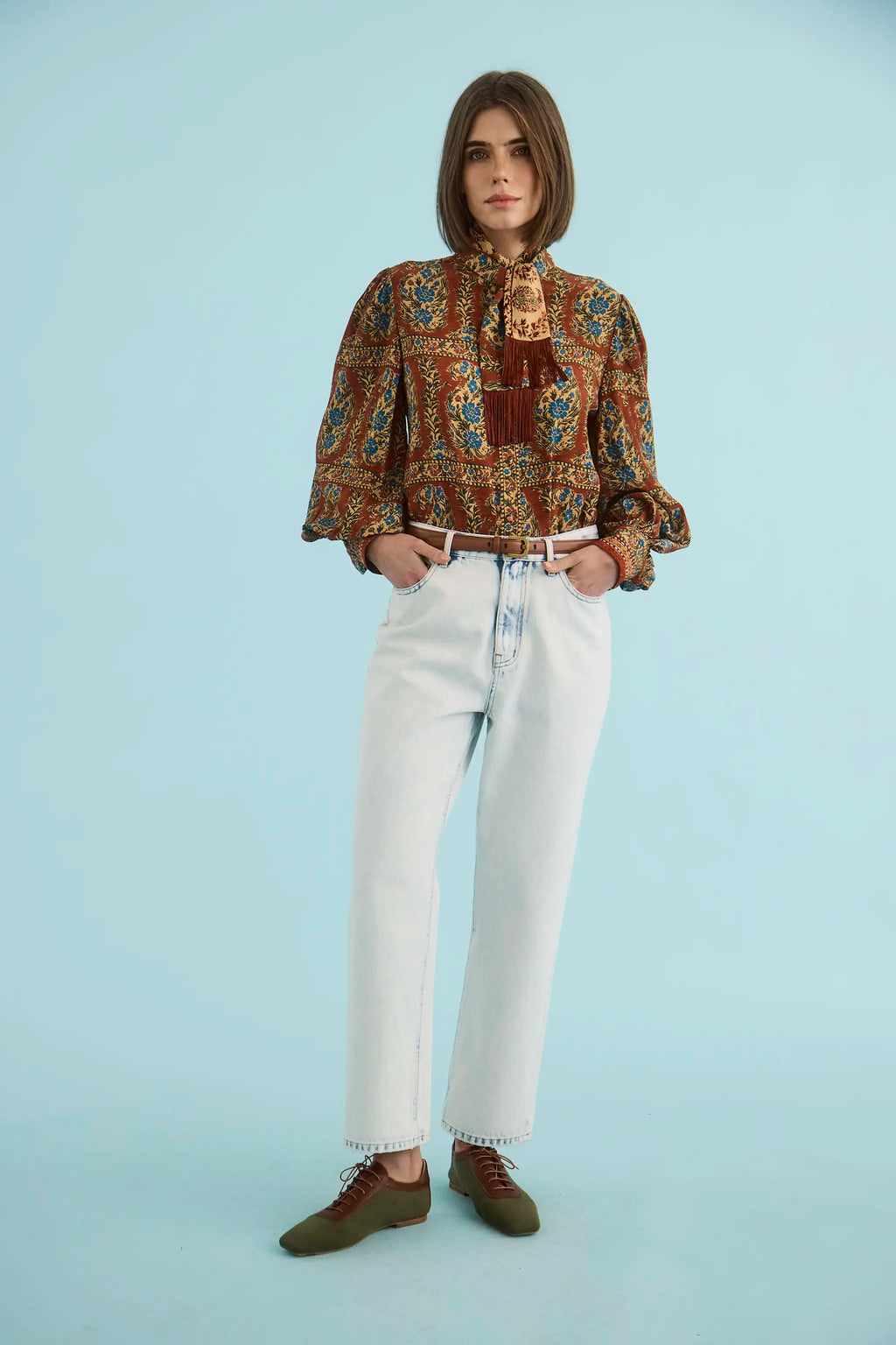 The Karis Blouse in Amber Glen Cream paired with the Wray Pant in Washed Blue Denim. 