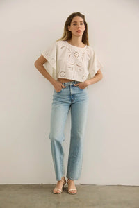 The Keira Top in White paired with denim.