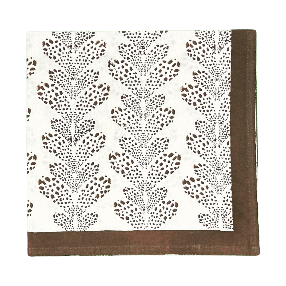 Front view of The Kelli Napkin in Dark Cocoa, Set of 4 showcasing a dotted pattern and dark cocoa border