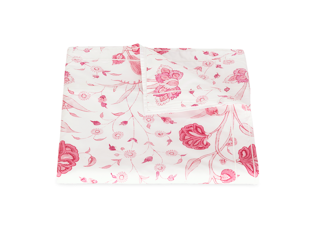 Front view of folded Khilana duvet cover showcasing pink Peony floral print on white background