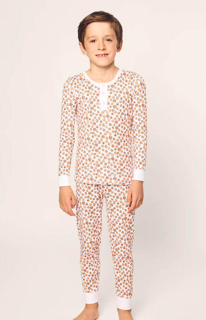 Front view of white Kid’s Pima Snug Fit Pajama Set in Pumpkin Patch showcasing snug fit and pumpkin print on plain light background