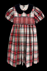 The Joy Kids Dress has a black velvet Peter Pan collar, smocked bodice, and puff short sleeves.