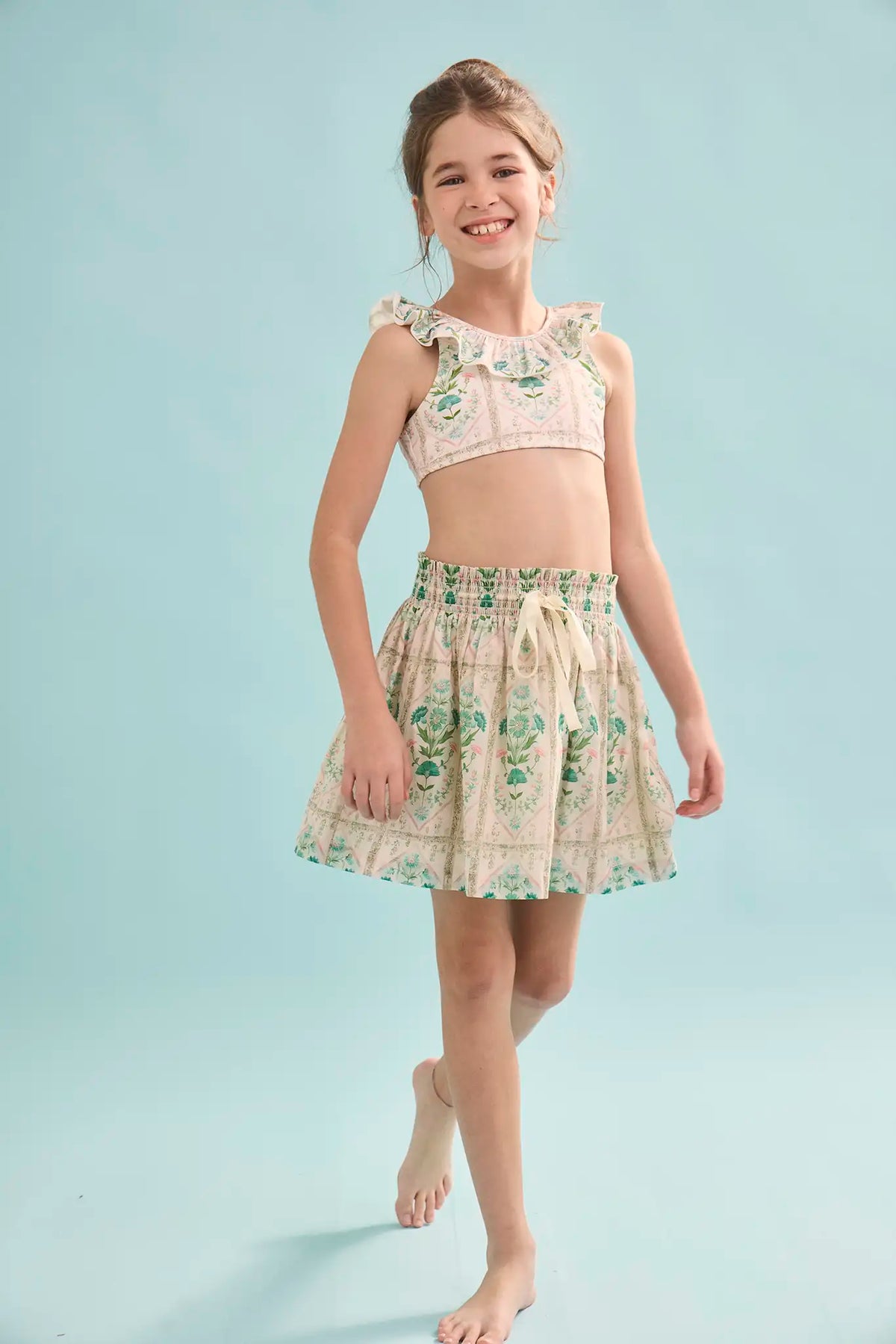 The Kids Two-Piece Swimset in Pink Trellis paired with matching Rosie Skirt.