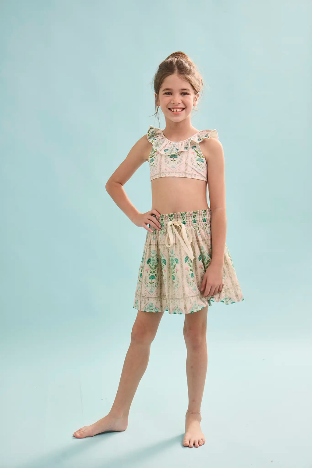 The Kids Two-Piece Swimset in Pink Trellis paired with matching Rosie Skirt.