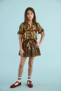 The Kids Mayfair Blouse in Amber Glen Cream paired with the Rosie Skirt in Amber Glen Brown.