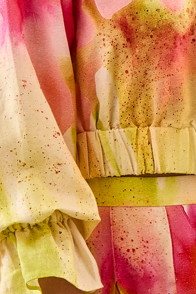 Cropped long sleeve top in yellow and pink tie-dye print with elastic at the sleeves