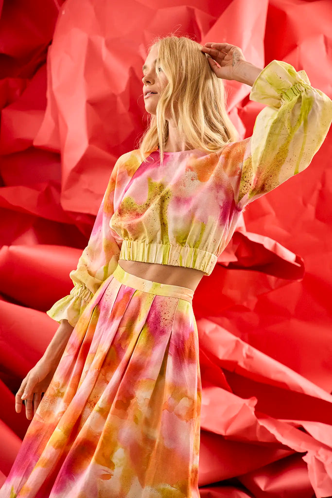 Cropped long sleeve top in yellow and pink tie-dye print with elastic at the sleeves