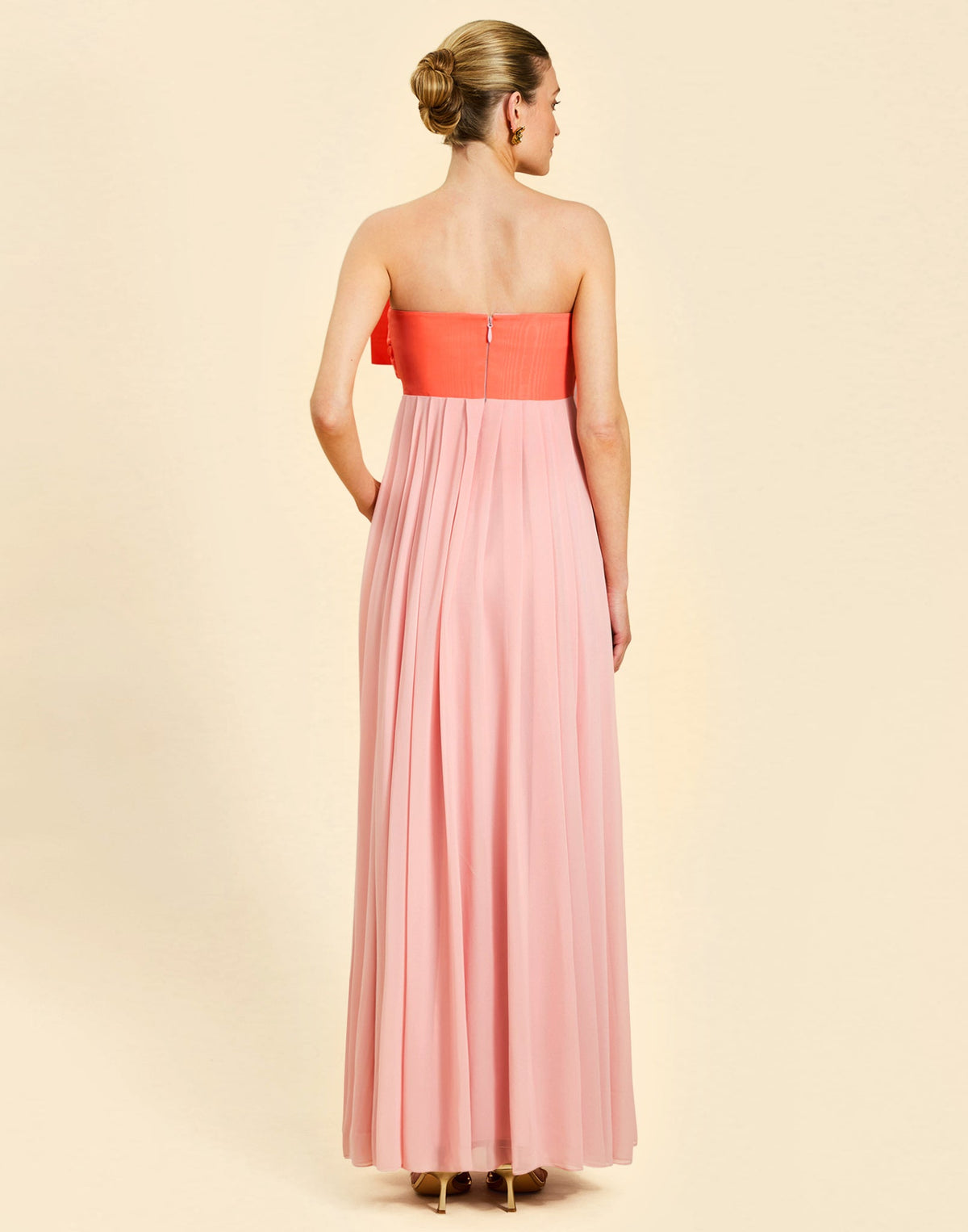 Kiss Me Knot Gown in Bloom Pink chiffon with oversized bow neckline, strapless silhouette, and flowing skirt.