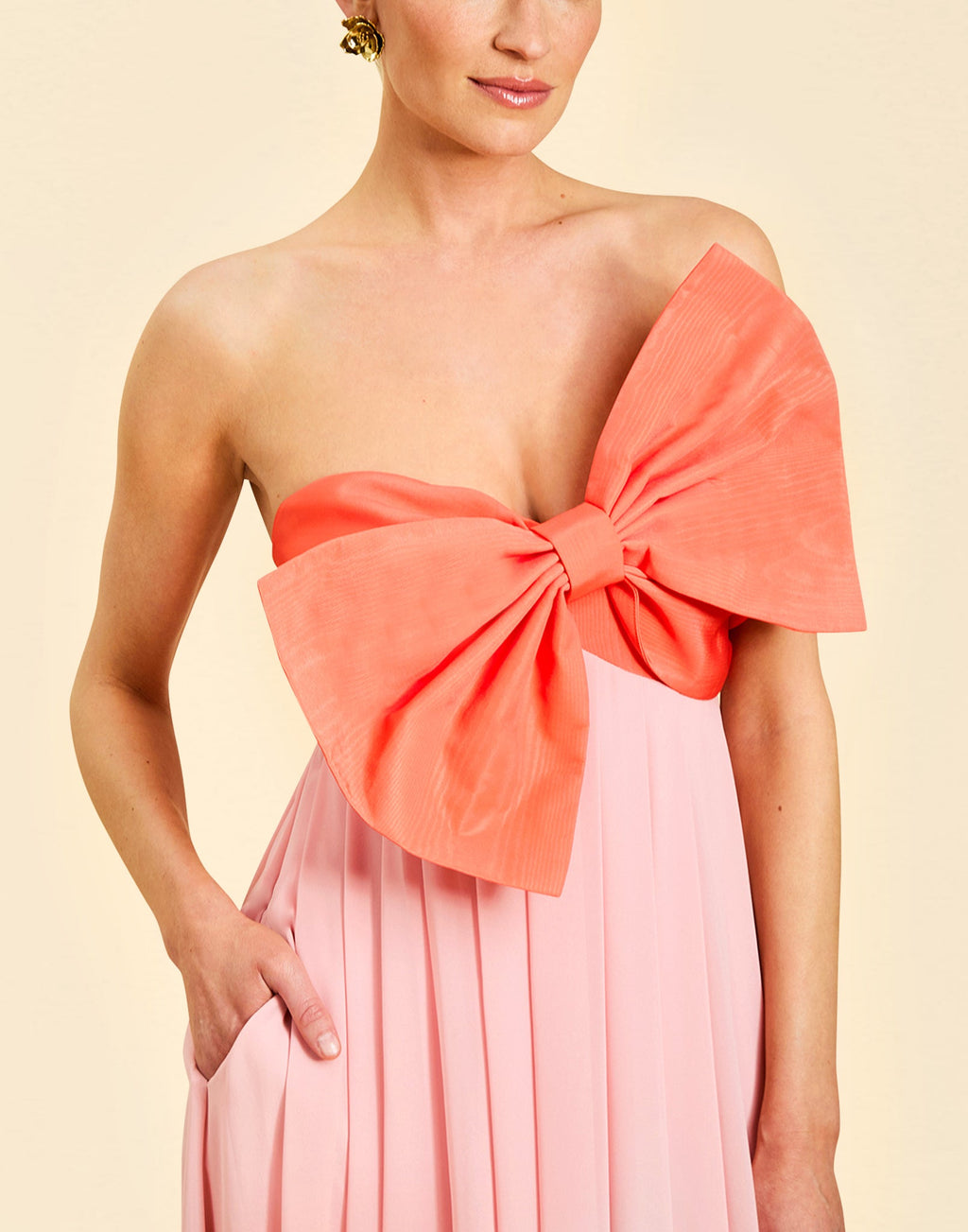 Kiss Me Knot Gown in Bloom Pink chiffon with oversized bow neckline, strapless silhouette, and flowing skirt.
