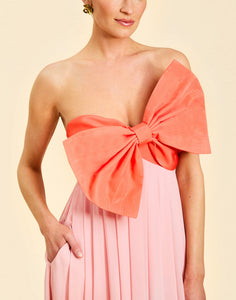 Kiss Me Knot Gown in Bloom Pink chiffon with oversized bow neckline, strapless silhouette, and flowing skirt.