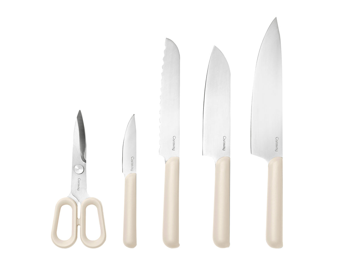 Front view of 5-piece knife set showing cream handles and stainless-steel blades on white background