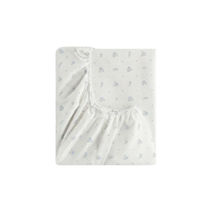 Fitted crib sheet with subtle pattern on a white background