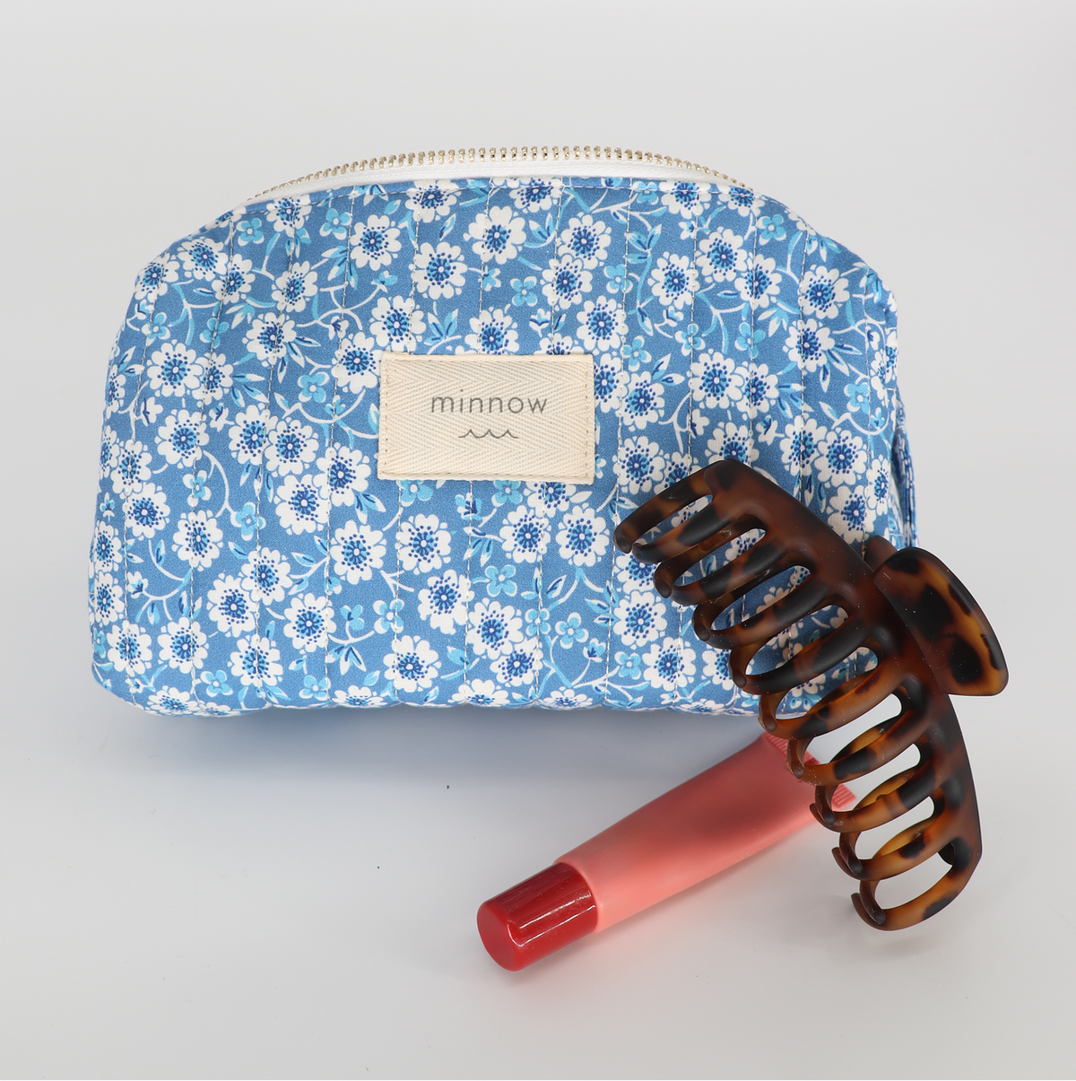 Front view of Rosebay Medium Toiletry Pouch showcasing rosebay floral quilted fabric and zipper closure