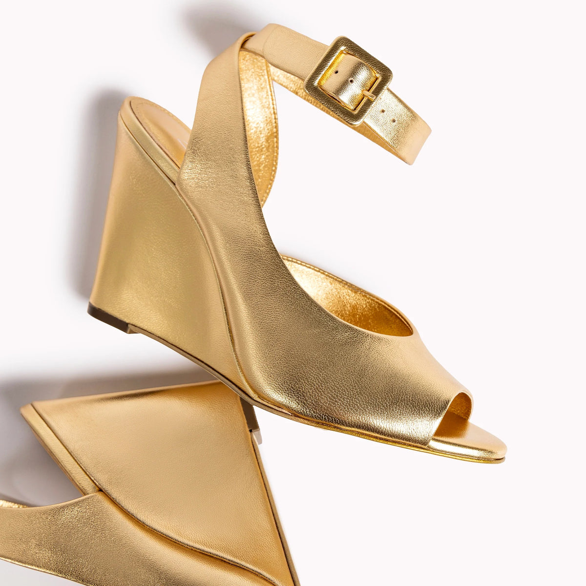 Deena By Larroudé Wedge Sandal In Gold Metallic Leather