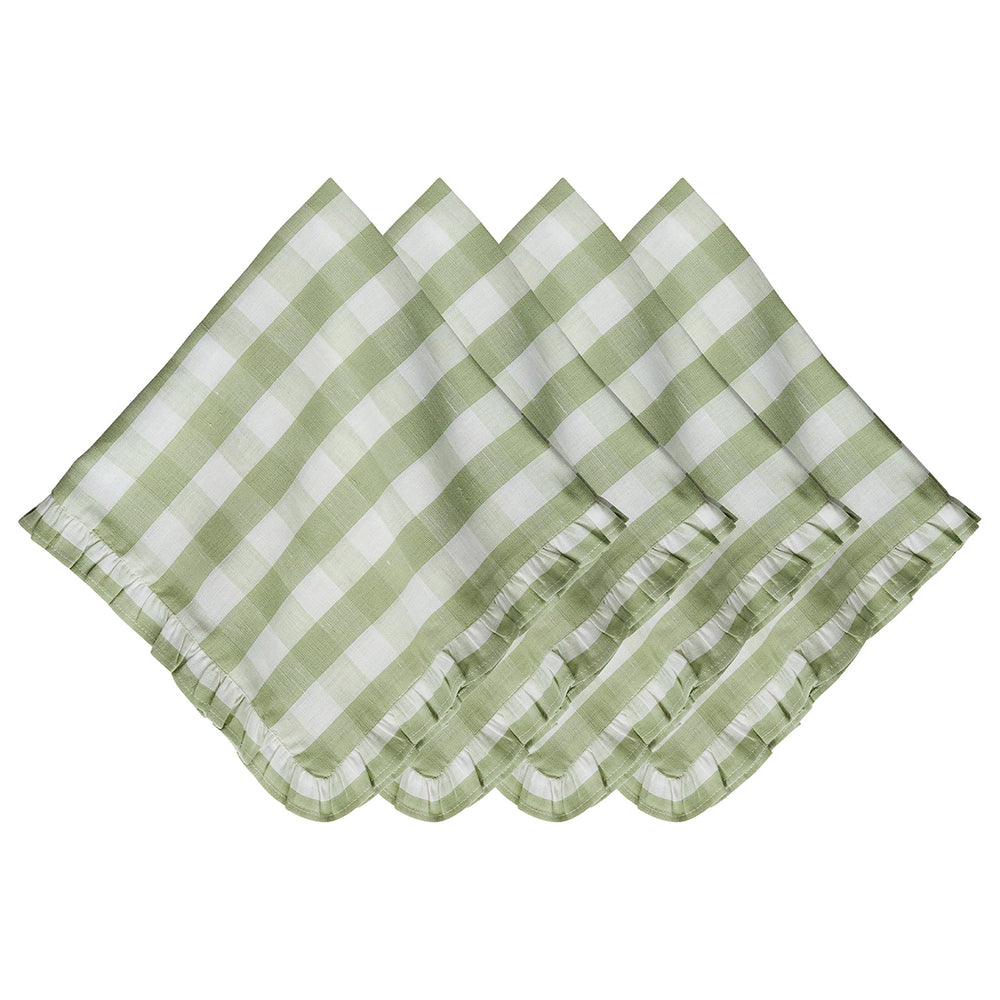 Flat-lay of four seagrass green gingham linen napkins showcasing ruffled edges on a white background