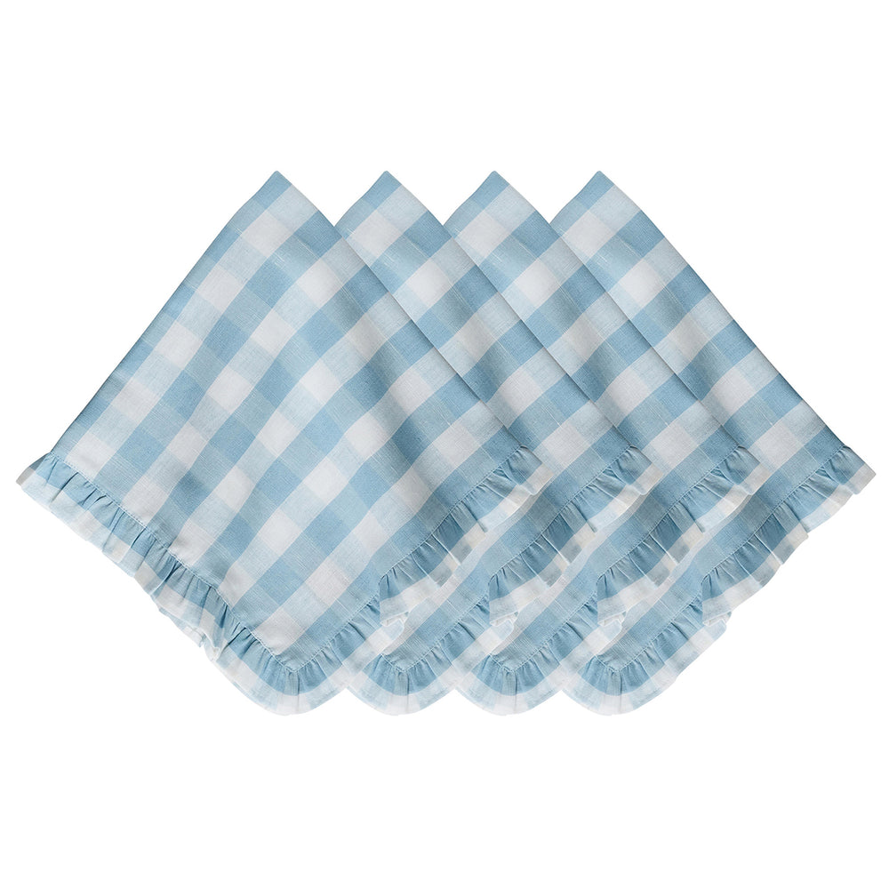 Top view of four ocean-blue gingham linen napkins stacked to show ruffled edges on a white background