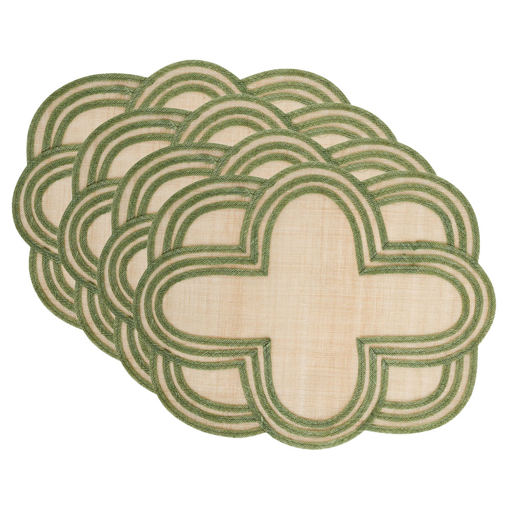 Angled view of Scallop Stripe placemats, set of four, in seagrass showing scalloped quatrefoil shape and green striped trim