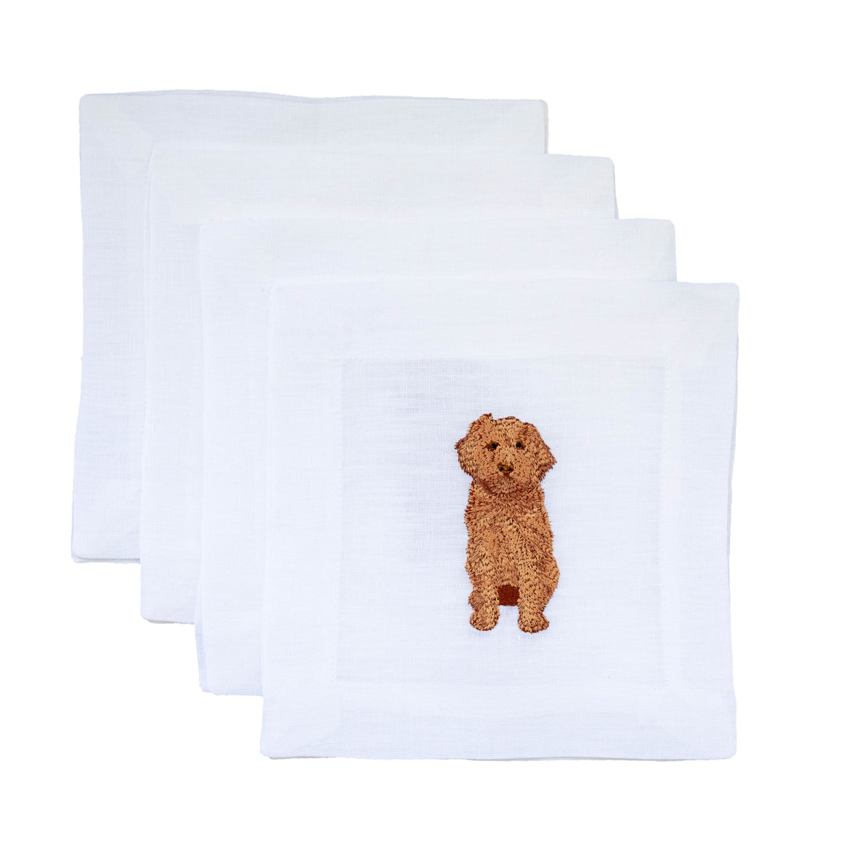 Top view of Cavapoo Cocktail Napkins showcasing embroidered brown Cavapoo icons on white linen with a white background