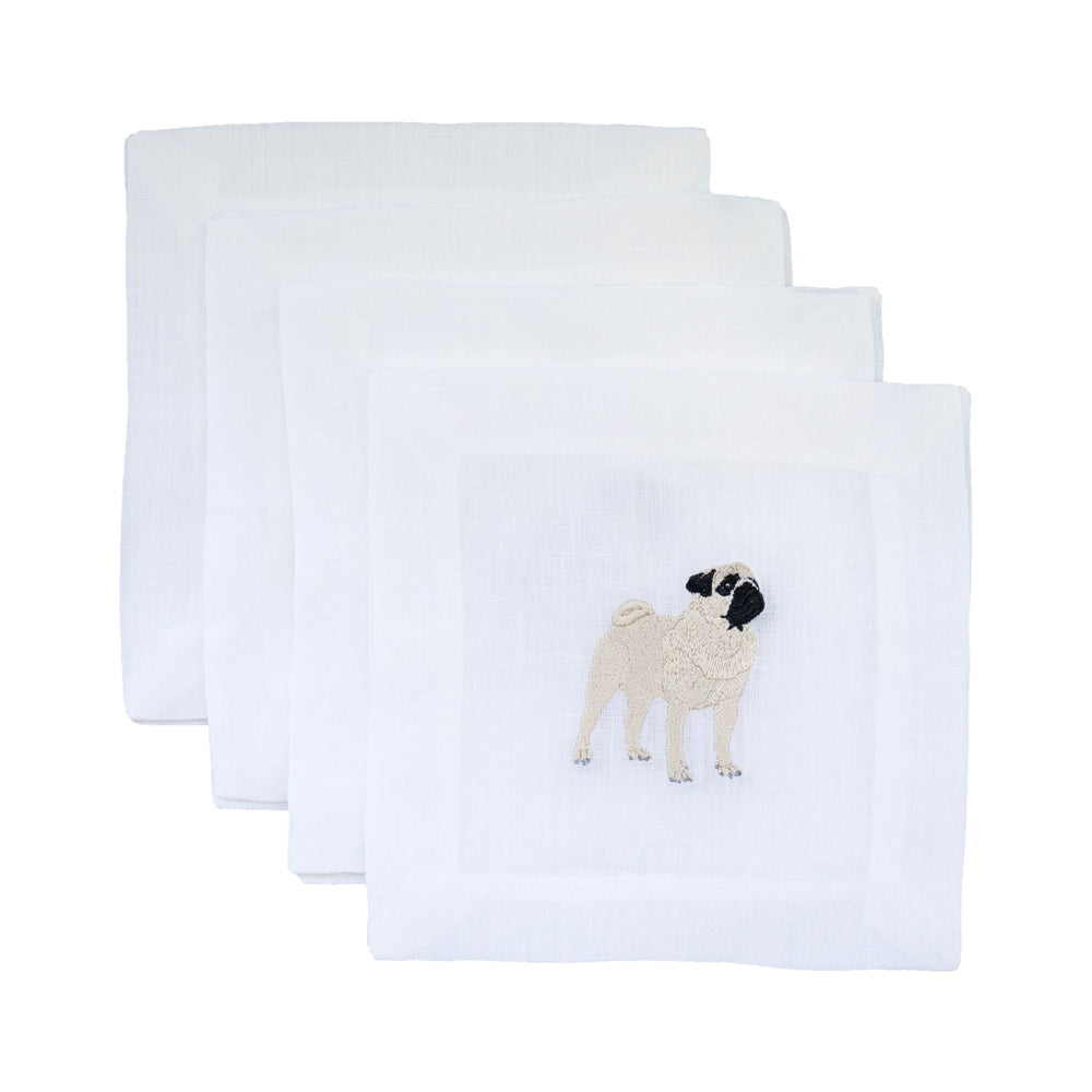 Front view of set of four white linen cocktail napkins showcasing an embroidered pug motif on one napkin against a white background