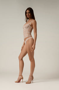 Embroidered bustier sleek side band on waist, mesh side panels, adjustable straps, hook and eye back closure side view