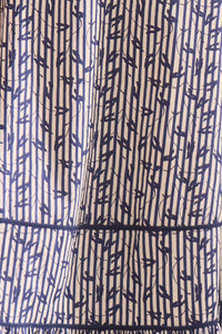 Vine Stripe peplum midi dress with a sleeveless bodice, sweetheart neckline, full circle skirt.