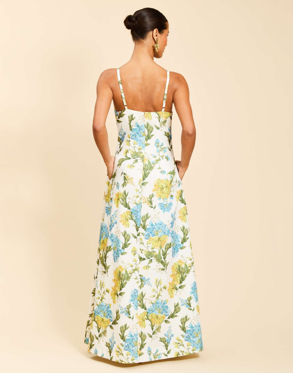 Ladera Gown in Verdant Blooms poly silk twill with straight neckline, mini bow straps, A-line silhouette, and side pockets.