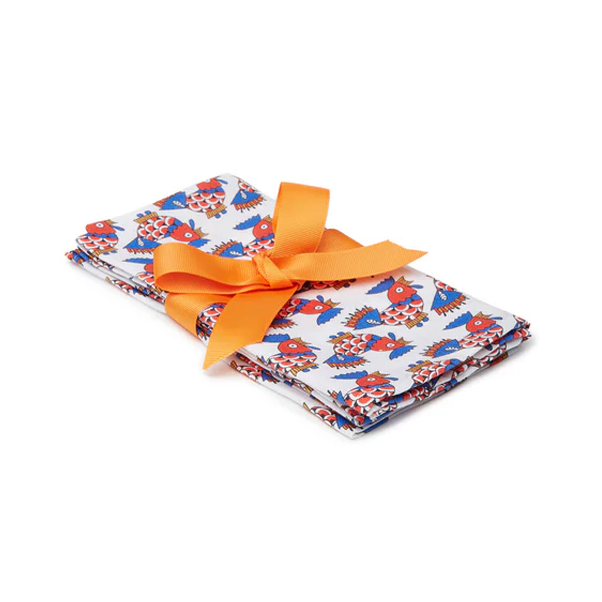 Angled view of Large Napkins in Galletti Multicolor, Set of 2 showcasing colorful fish print with orange ribbon on white background
