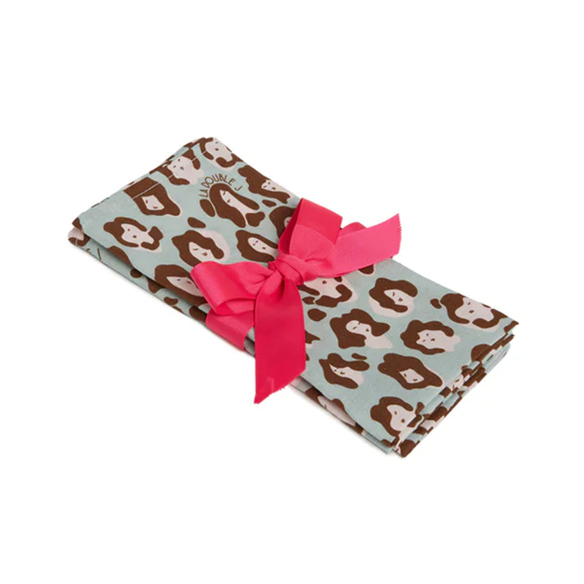 Angled view of Large Napkins in Lady Leopard Acquamarina, set of 2, with leopard-face print and pink bow