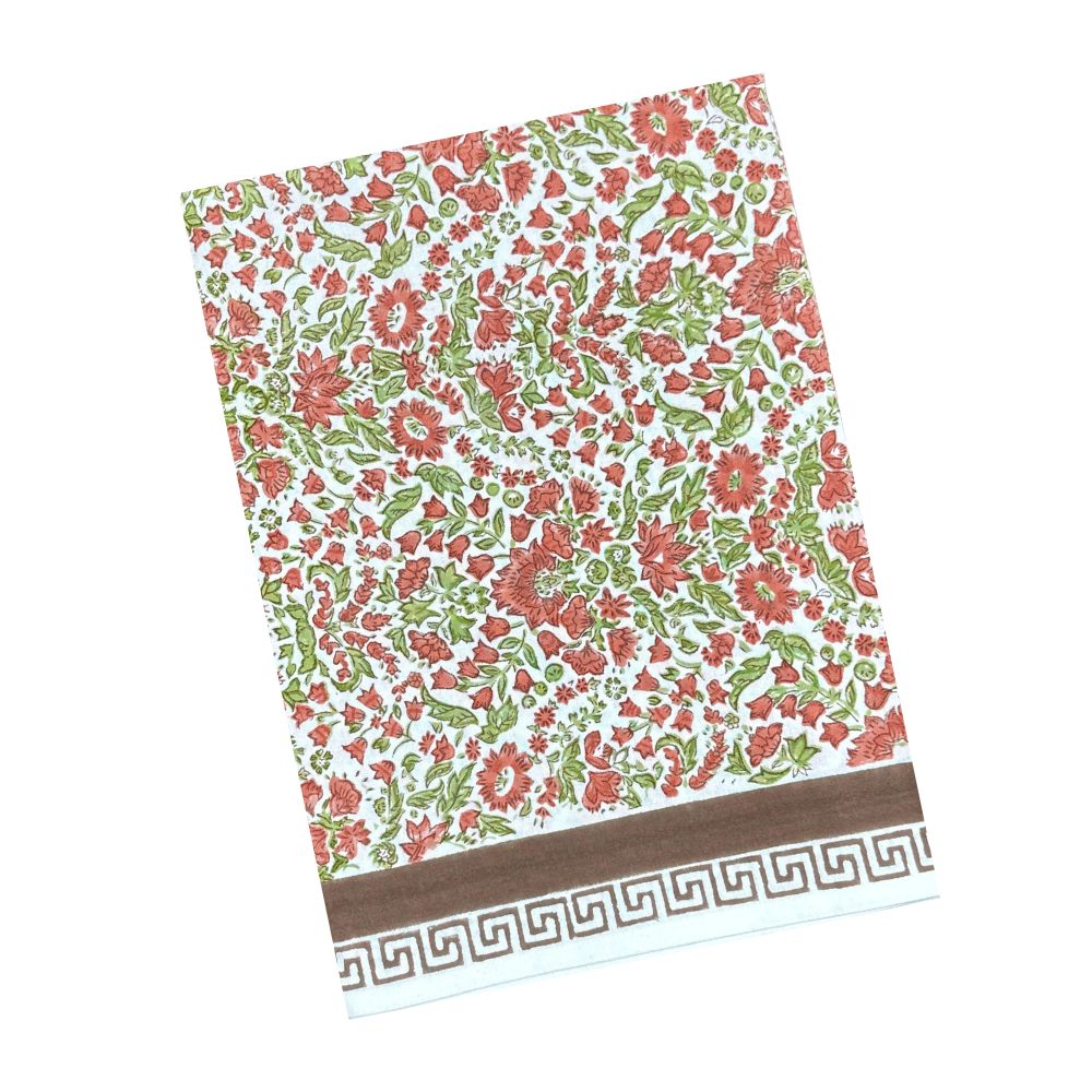 A hand block printed tablecloth, featuring a floral pumpkin and sage green floral pattern on a white background, finished with a brown band and Greek key border at the bottom, Thanksgiving tablecloth, luxury table linens