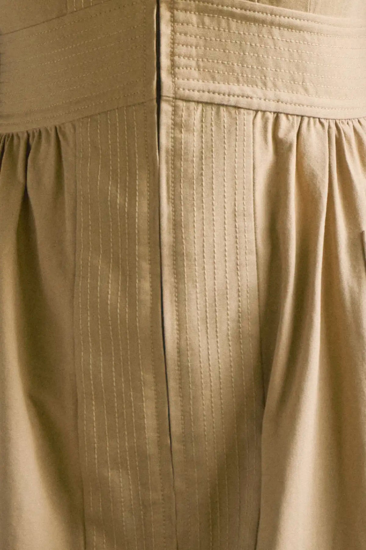 V-neck midi dress with a fitted bodice, full skirt, elbow-length sleeves finish with ties.