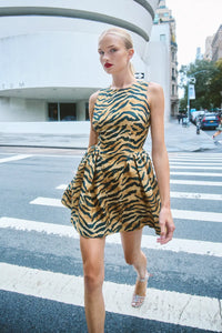 The Layne Dress is a sleeveless mini dress with a fit and flare style in our tiger print. 