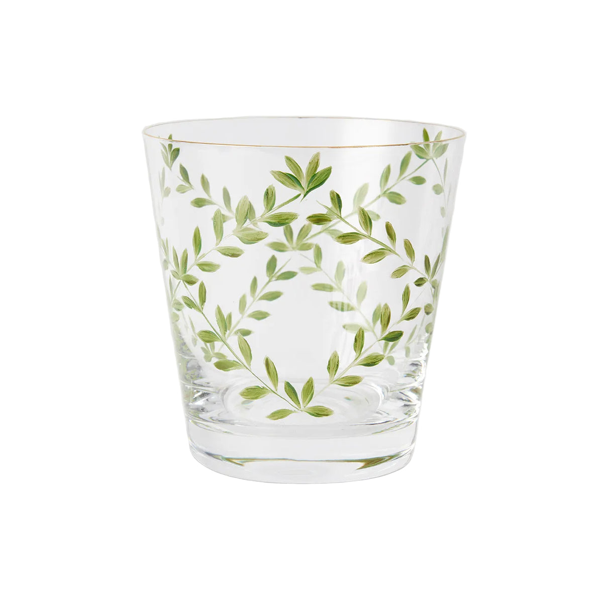 A product photograph of a clear glass tumbler with a subtle tapered shape and a gold rim, shown against a light gray background. The front of the glass is delicately hand-painted with a botanical design featuring slender, arching green branches and delicate leaves arranged in an elegant, symmetrical wreath formation.