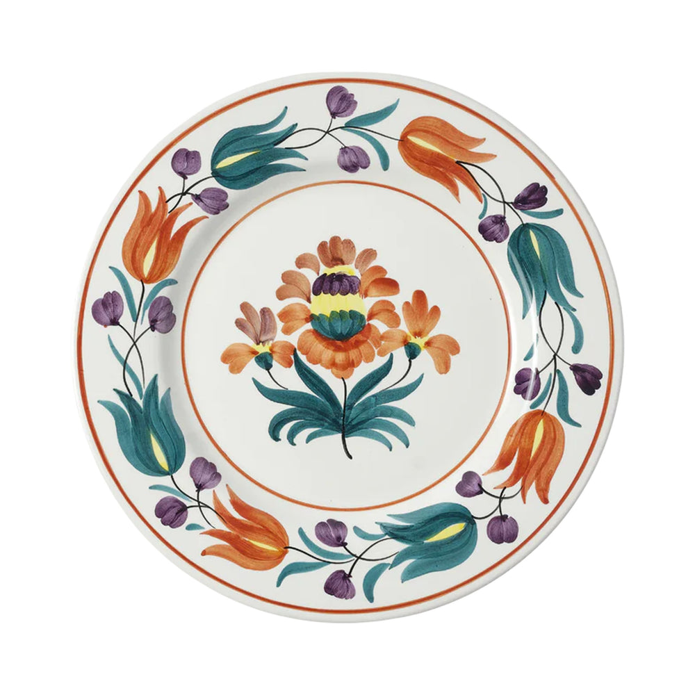 Top view of Lia dinner plate showcasing hand-painted orange, teal, and purple floral pattern on a white background