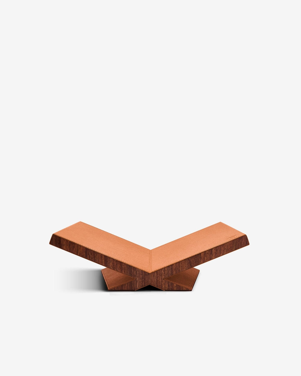 Straight-on view of Culture Classic Bookstand showcasing camel pebbled leather top and walnut V-shaped base on white background