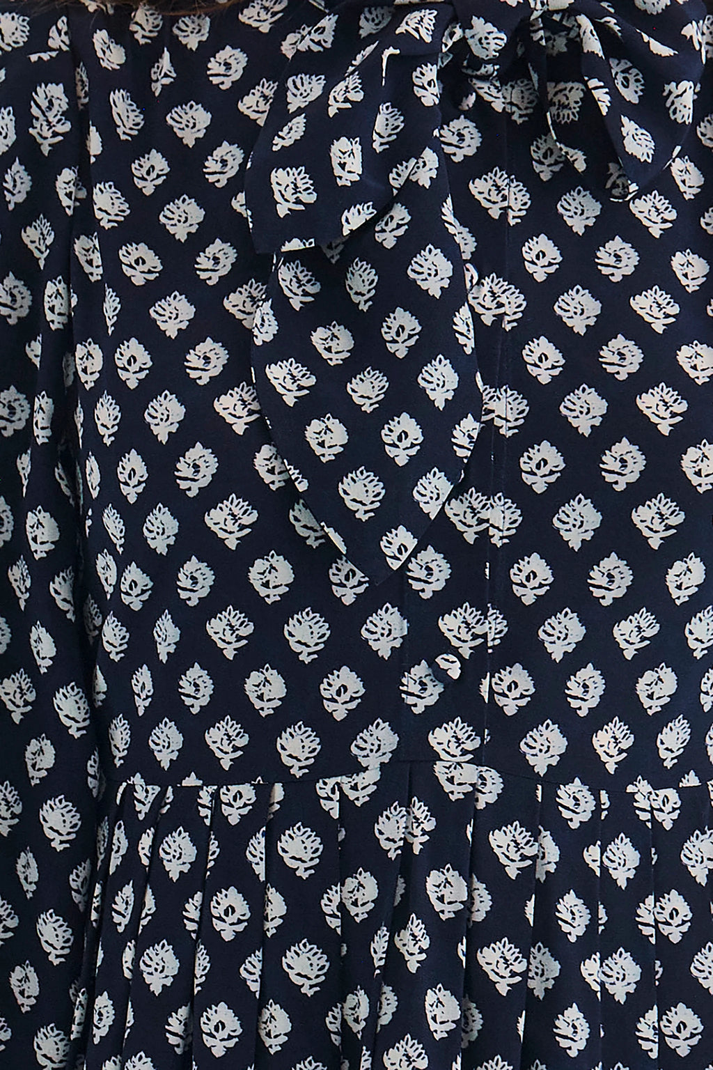 Close up of the Lila Dress in Thistle & Vine Blue. 