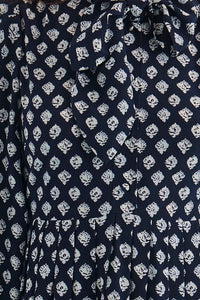 Close up of the Lila Dress in Thistle & Vine Blue. 