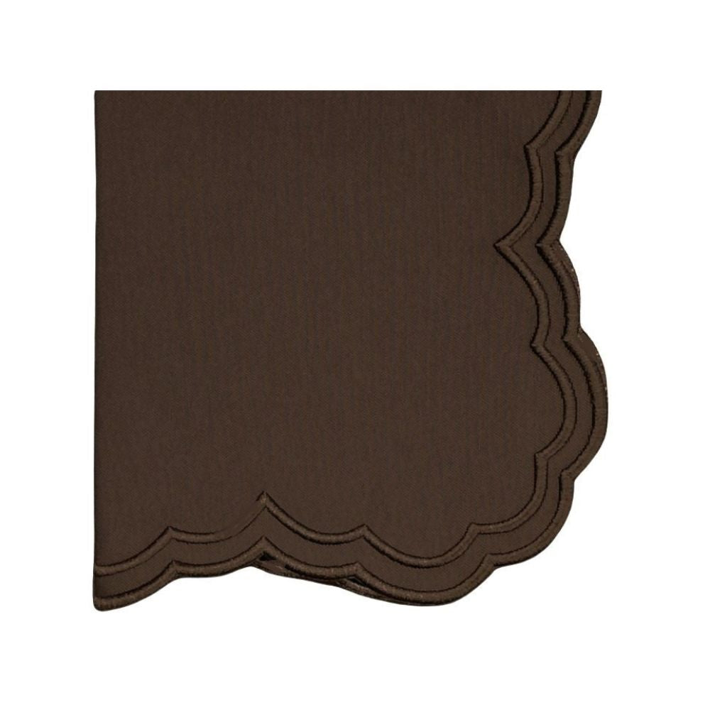 Folded view of Lillian napkin in cocoa showcasing scalloped embroidered edge on white background