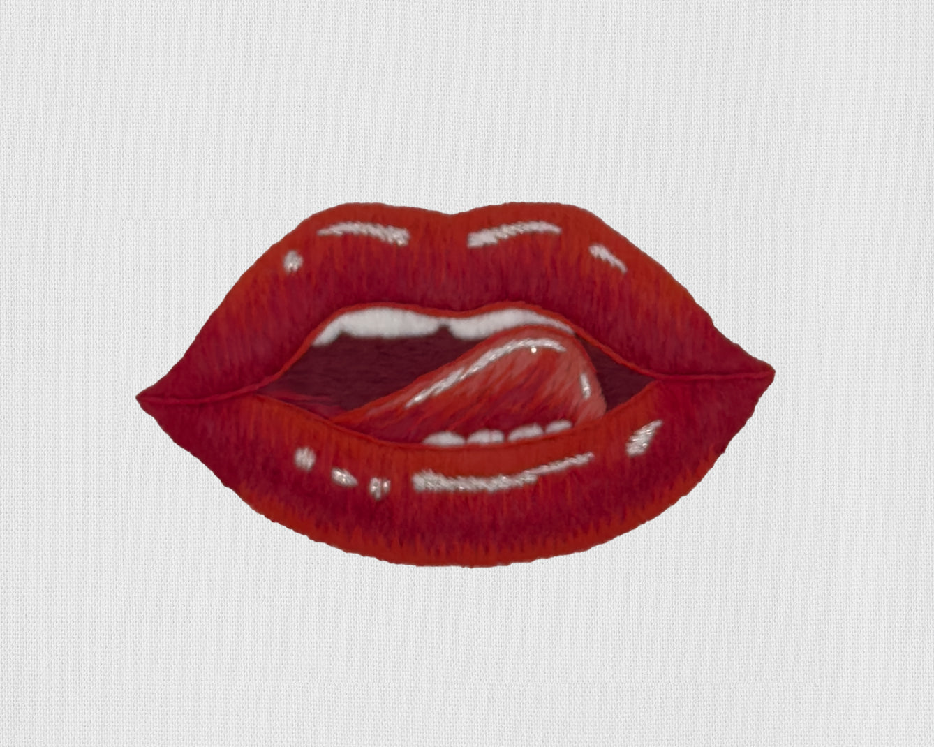 Image of a Henry Handwork Lips motif.