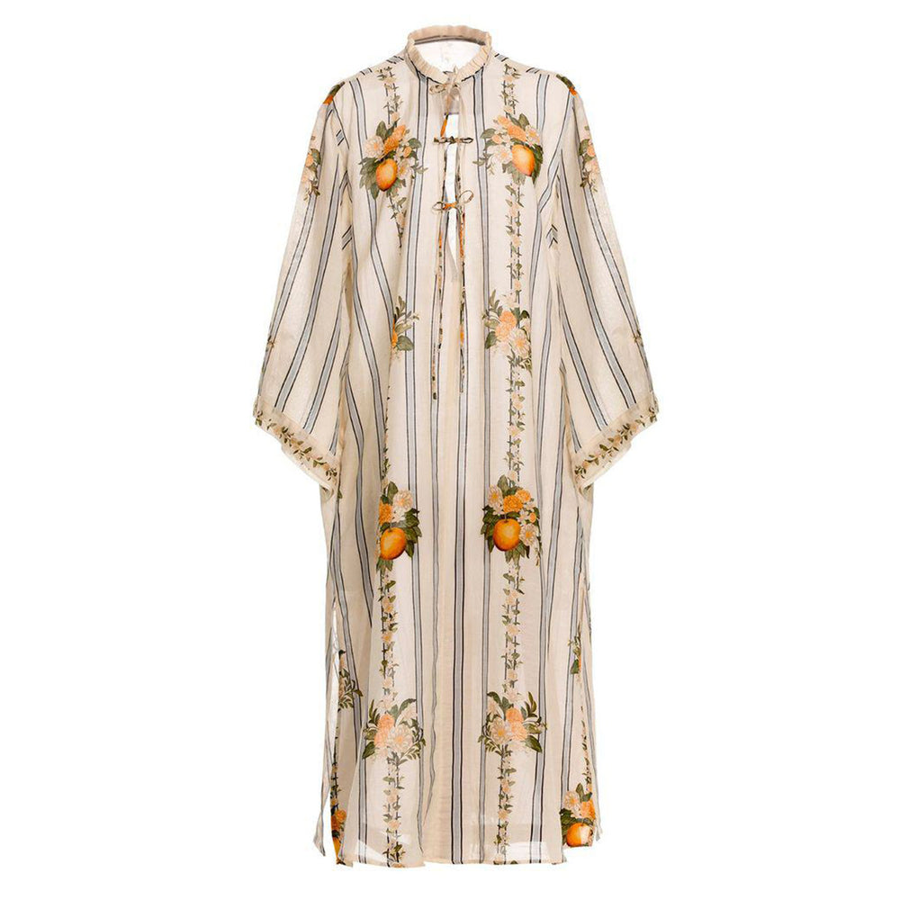 Front view of Datil Valle kaftan showcasing vertical stripes and orange citrus botanical print on white background