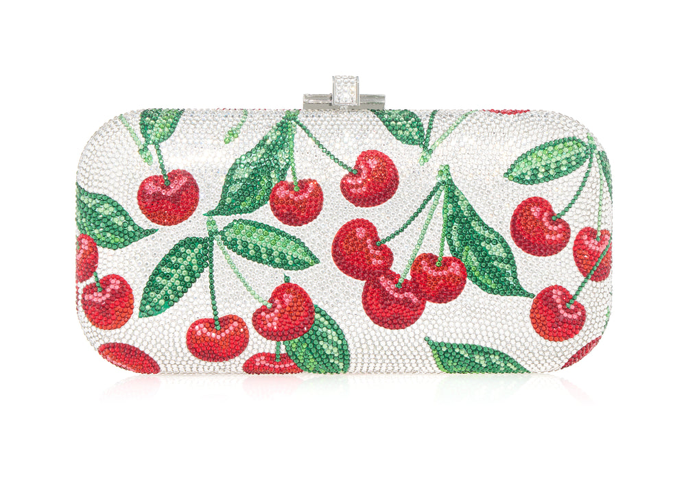 Front view of Long Slide Bing Cherries clutch showcasing crystal encrusted red cherry motif on a silver-toned background