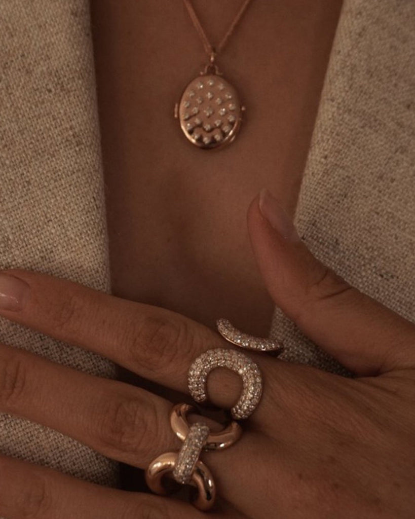 Etoile Locket Necklace shown with the Princess Necklace, Love Lock Ring, and Medusa Ring, 14k yellow gold