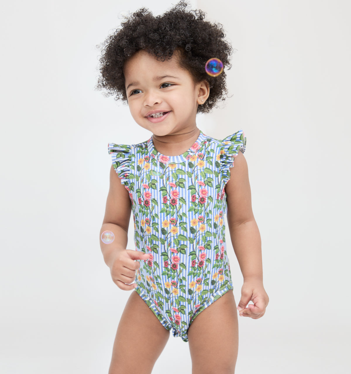 The Jillee Ruffle Onesie in Geranium Stripe