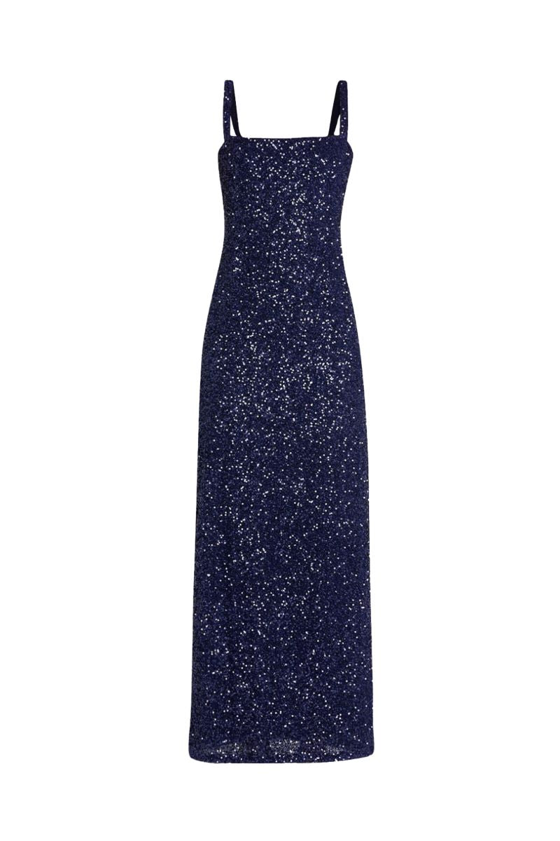 Front view of Luciérnaga Dress in navy showcasing full-length sequined fabric and square neckline on white background