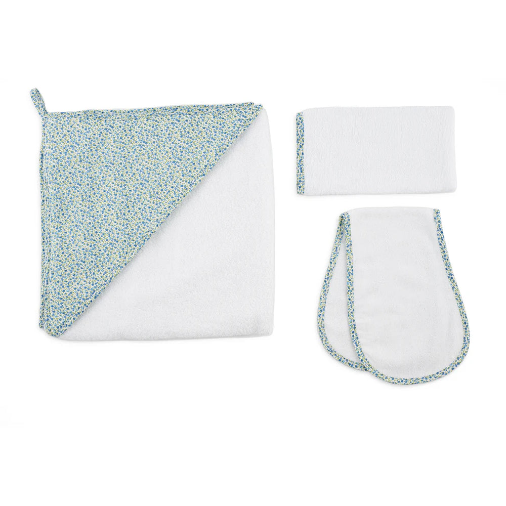 Flat lay of Lucky Bath Set showcasing a hooded towel, matching washcloth, and burp cloth with blue floral trim on white background