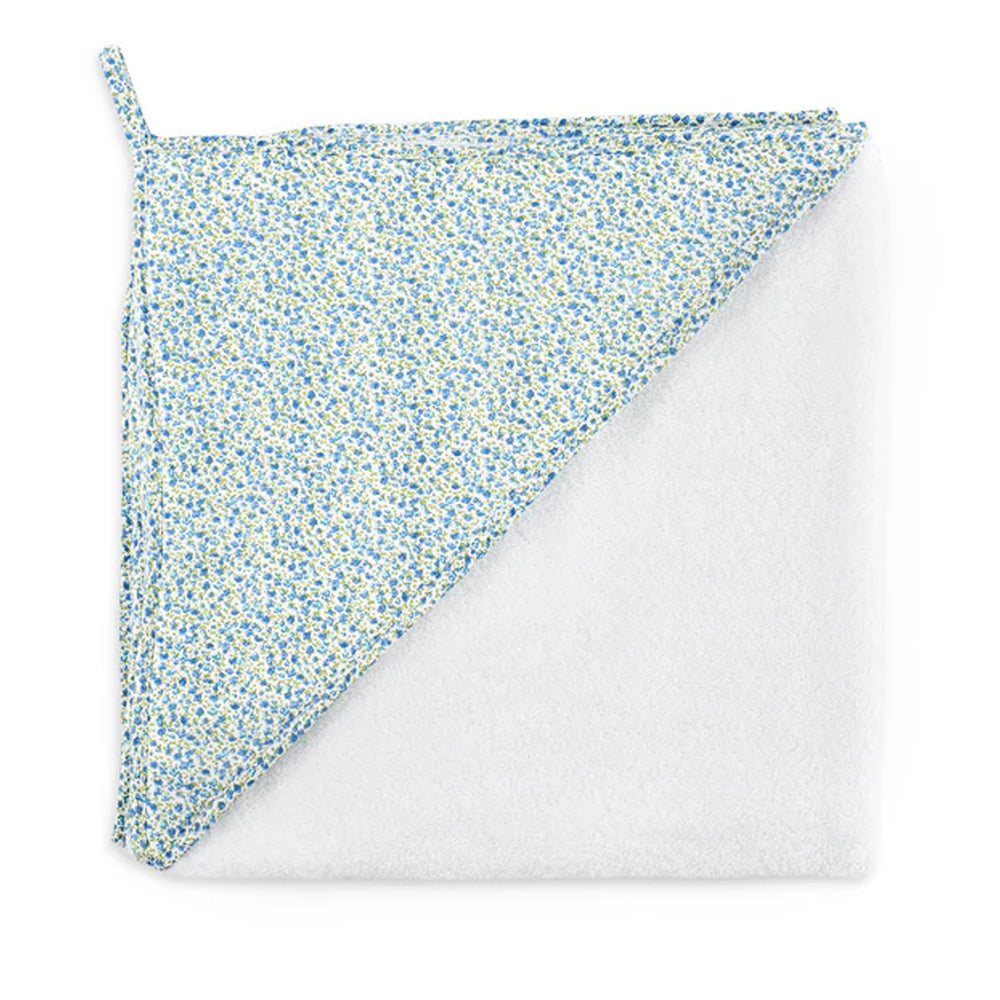 Top down view of Lucky Hooded Towel showing white terry cotton with blue floral hood trim on white background