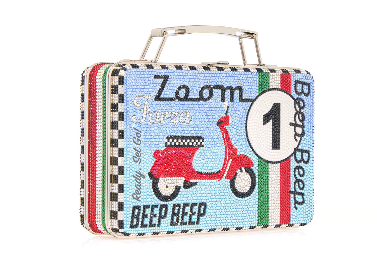 Three-quarter view of Beep Beep Lunch Box Clutch with crystal-encrusted scooter motif, Zoom and Beep Beep text, top handle