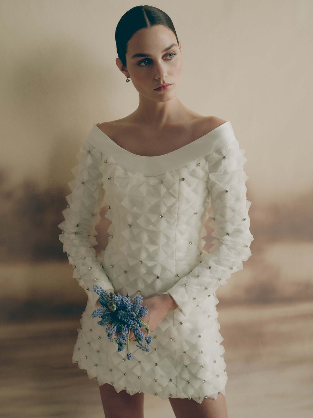 Front view of Celestine Dress on model showing off-the-shoulder satin neckline and crystal-embellished tulle mini