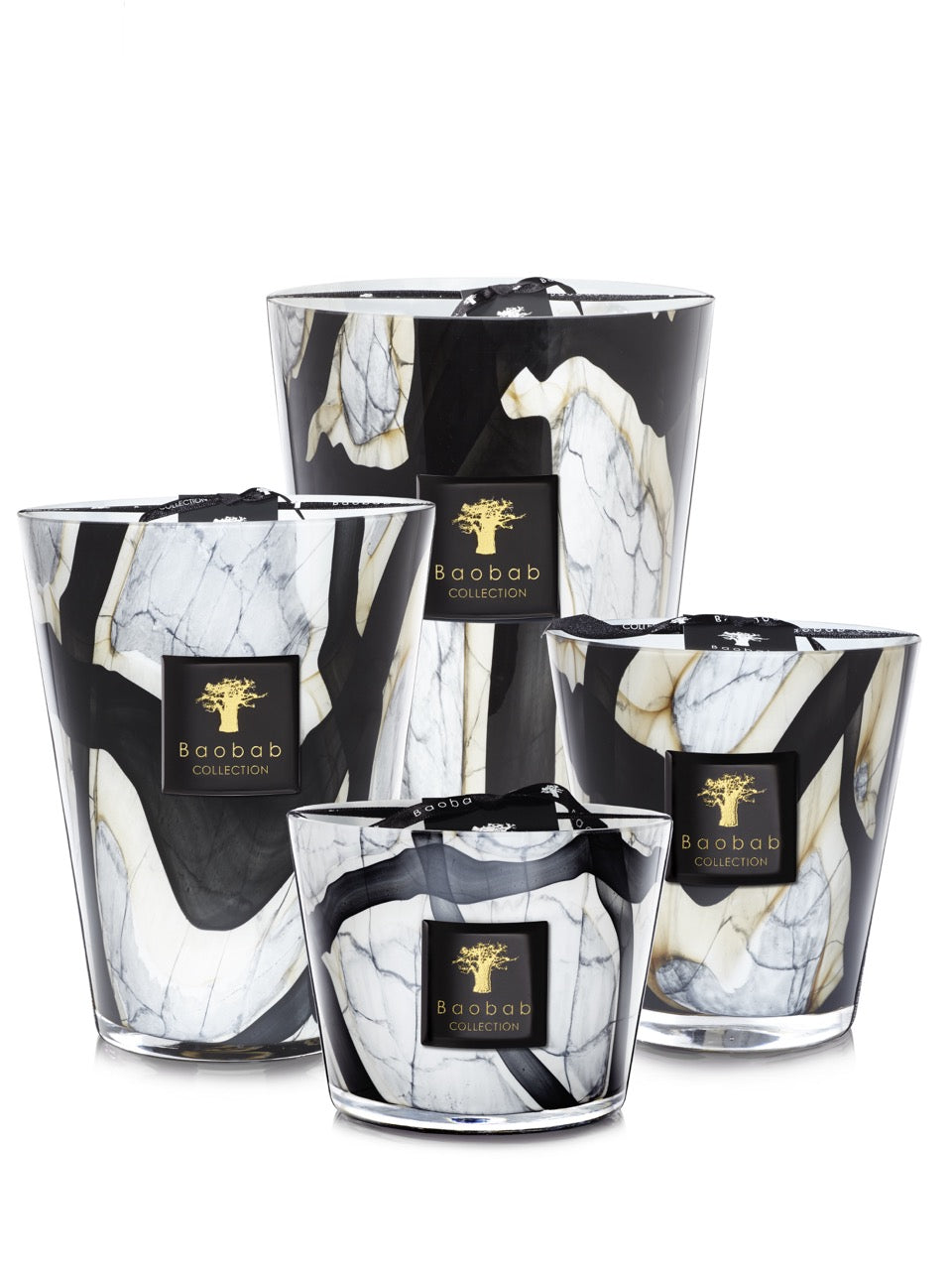 Group view of Max 10 Stones Marble candles showcasing marbled black and white glass and gold Baobab labels on white