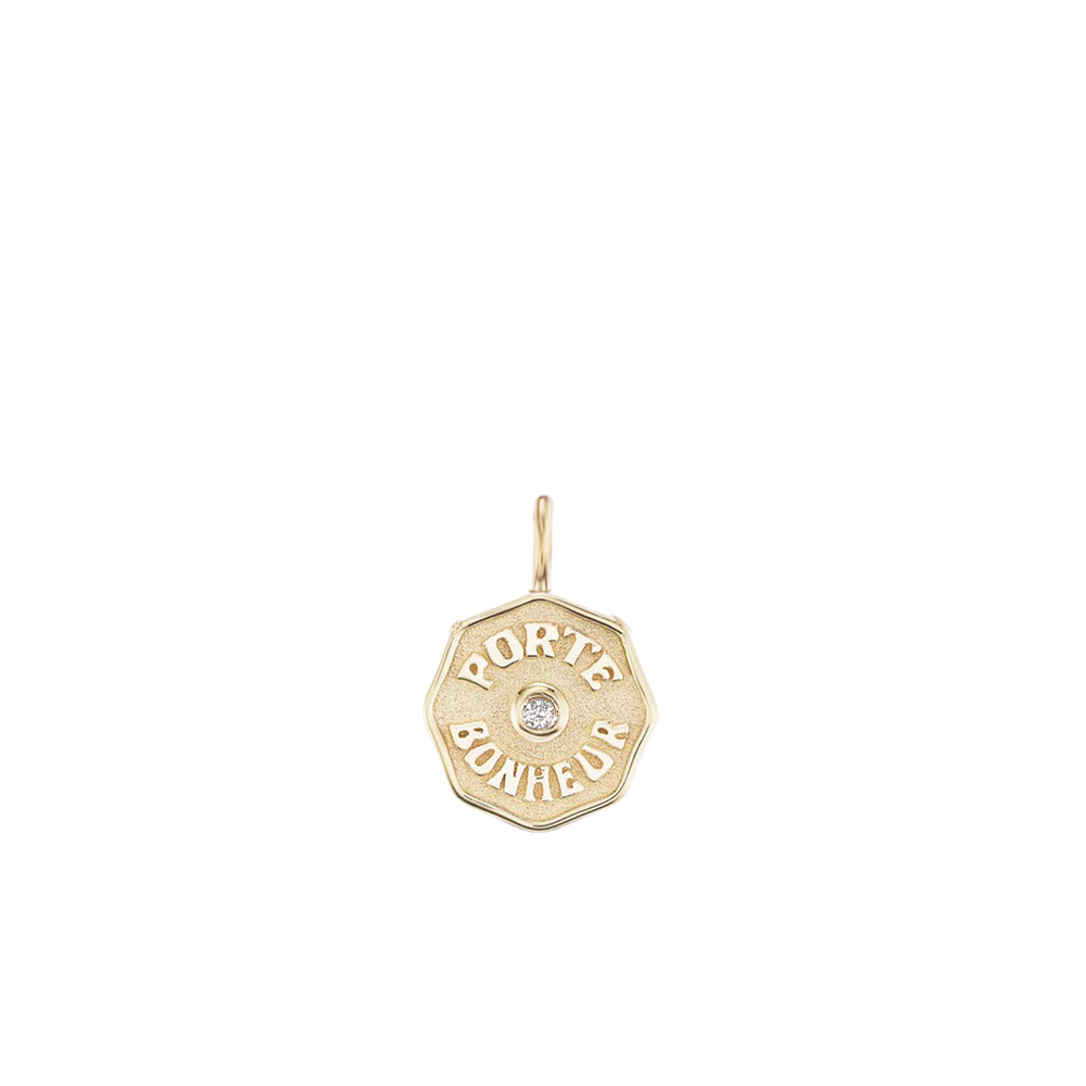 Front view of Wee PB 14k gold coin charm with white diamond and raised Porte Bonheur inscription on white background