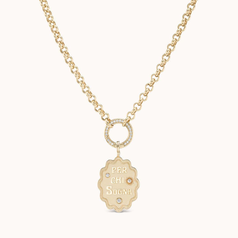 Front of Per Chi Sogna oval charm necklace with gold pendant engraved PER CHI SOGNA and diamond ring on chain